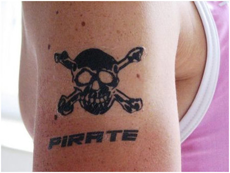 Small Black Pirate Skull With Bones Tattoo On Right Half Sleeve