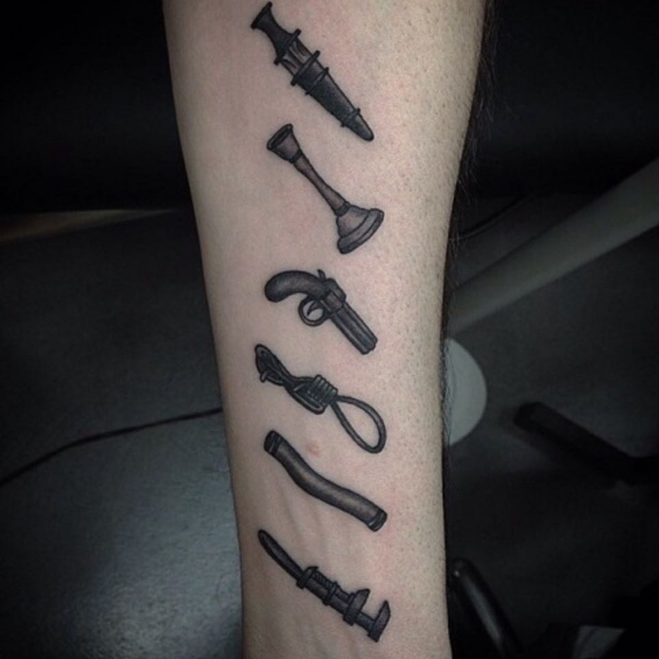 Small Black Weapons Tattoo On Forearm