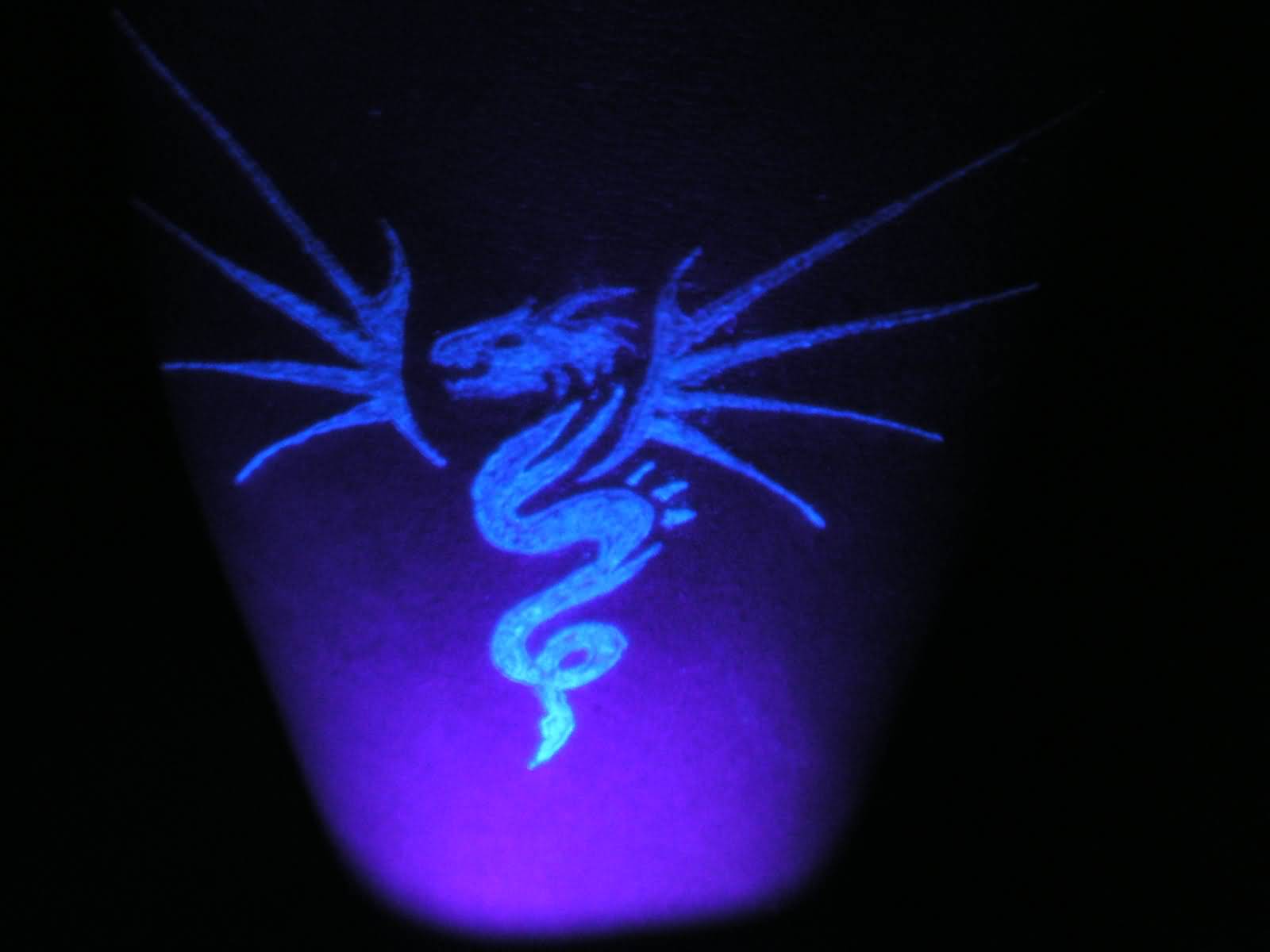 Small Dragon Symbol UV Tattoo