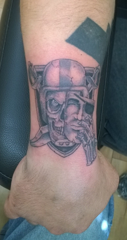 Small Grey Oakland Raiders Tattoo On Wrist