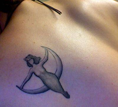 Small Grey Pagan Goddess Tattoo On Right Shoulder