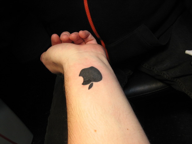 Small IPhone Logo Silhouette Tattoo On Wrist