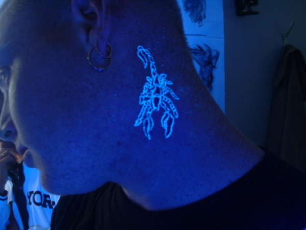 Small Scorpion UV Tattoo On Side Neck