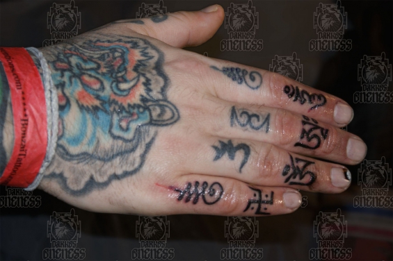 Small Tibetan Symbols Tattoo On Hand