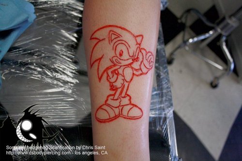 Sonic Scarification Tattoo On Arm By Chris Saint