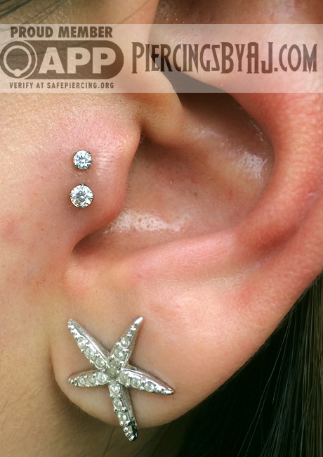Star Stud Earlobe And Double Tragus Piercing