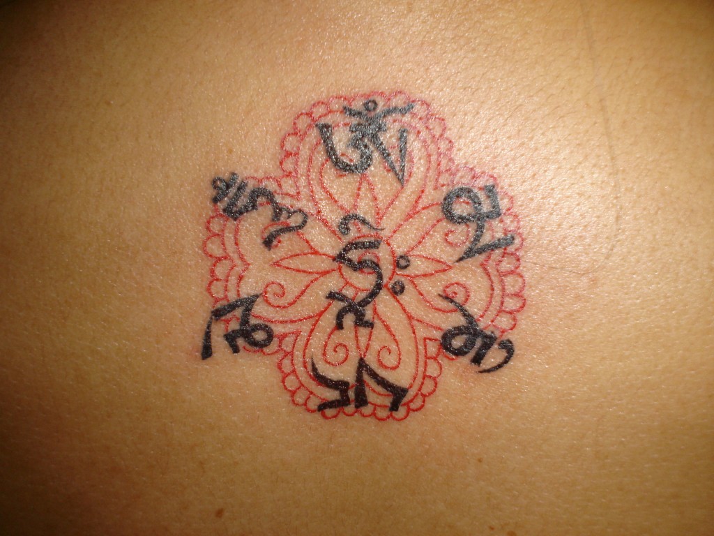 Tibetan Om With Flower Tattoo