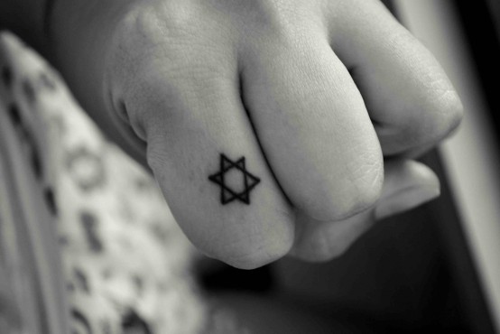 Tiny Star Of David Tattoo On Finger