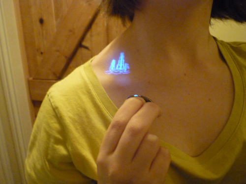 Tiny UV Tattoo On Collarbone For Girls