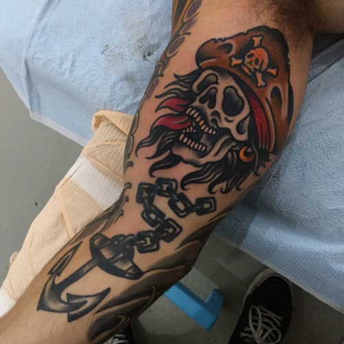 Traditional Pirate Skull With Anchor Tattoo On Arm