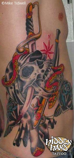Traditional Pirate Skull With Sword Tattoo On Side Rib