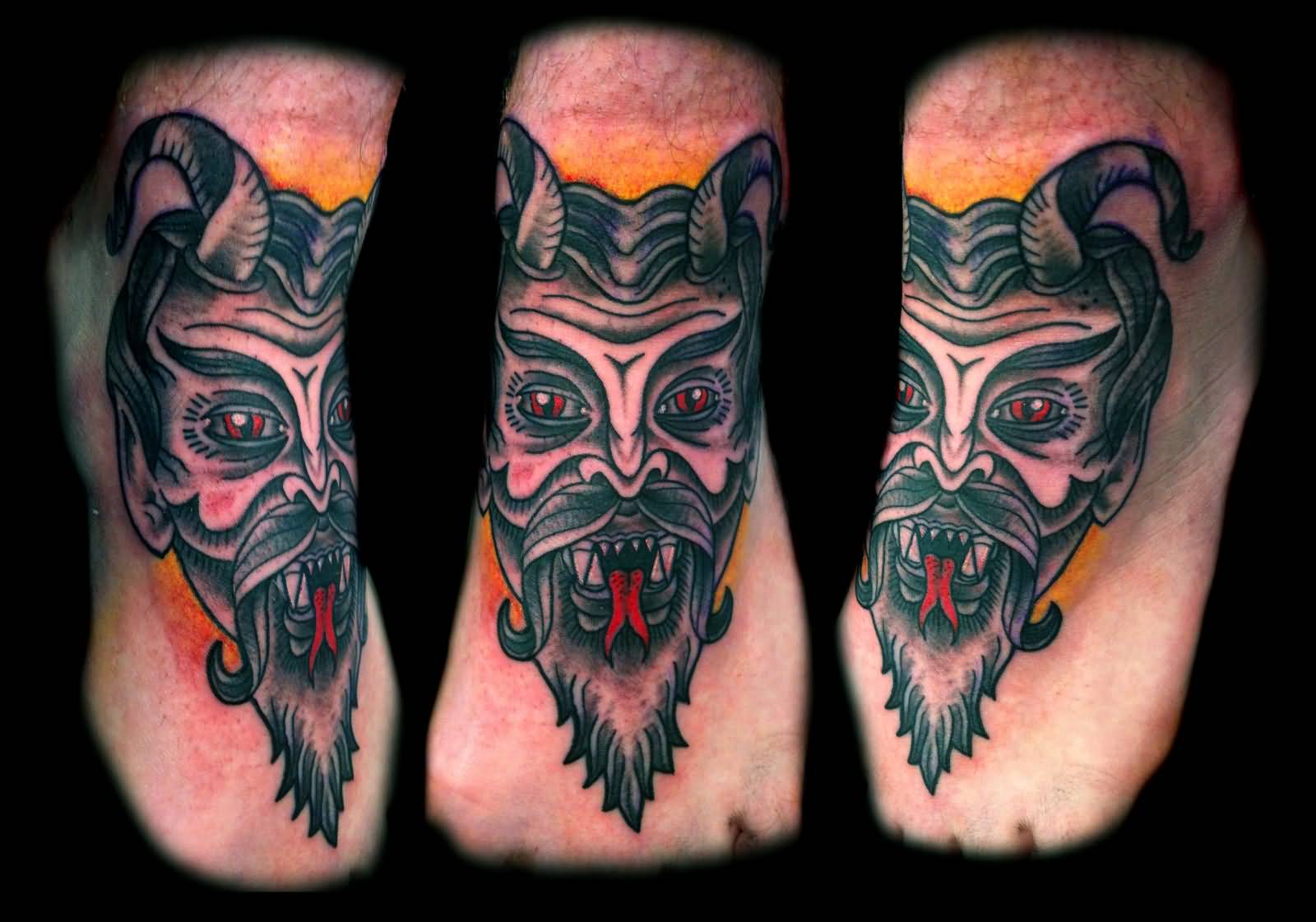 Traditional Satan Face Tattoo On Foot