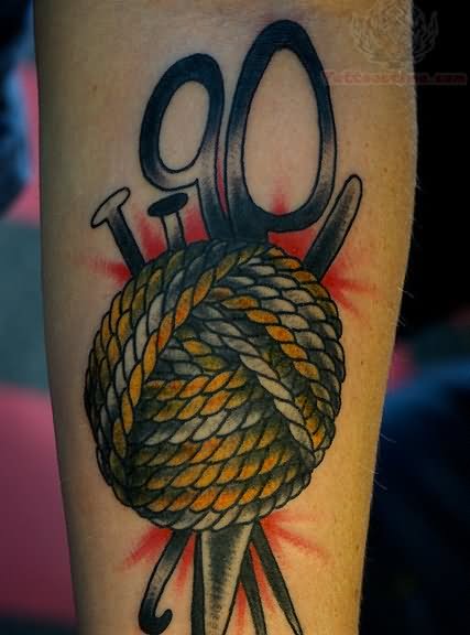 Traditional Yarn And Scissor Tattoo On Forearm