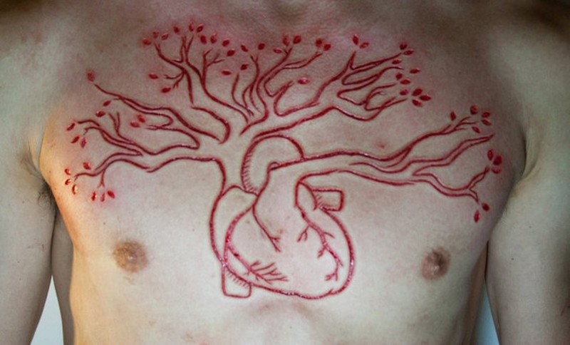 Tree Grown From Heart Tattoo On Chest For Men