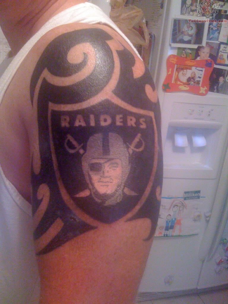 Tribal Design With Oakland Raiders Logo Shoulder Tattoo.