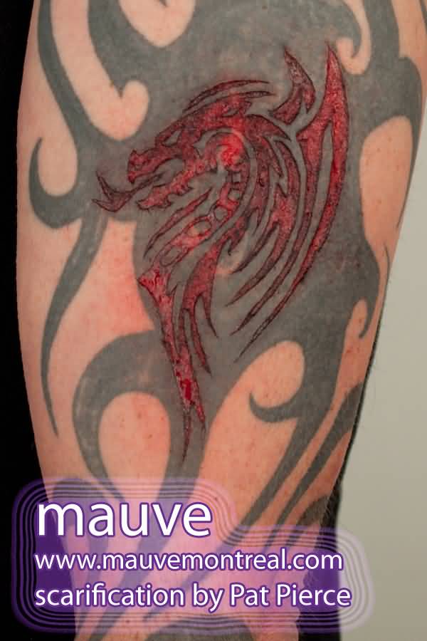Tribal Dragon Symbol Scarification Tattoo