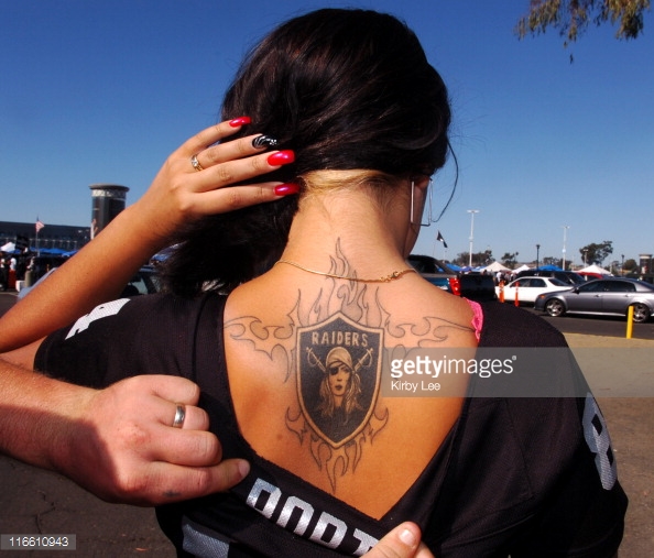 Tribal Oakland Raiders Logo Tattoo On Upper Back