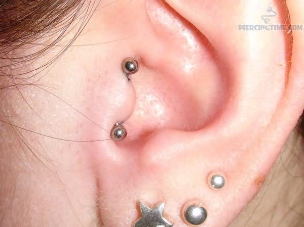 Triple Ear Lobe And Double Tragus Piercing