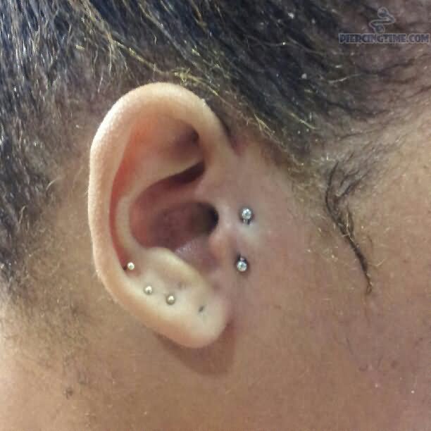Triple Right Ear Lobe And Double Tragus Piercing