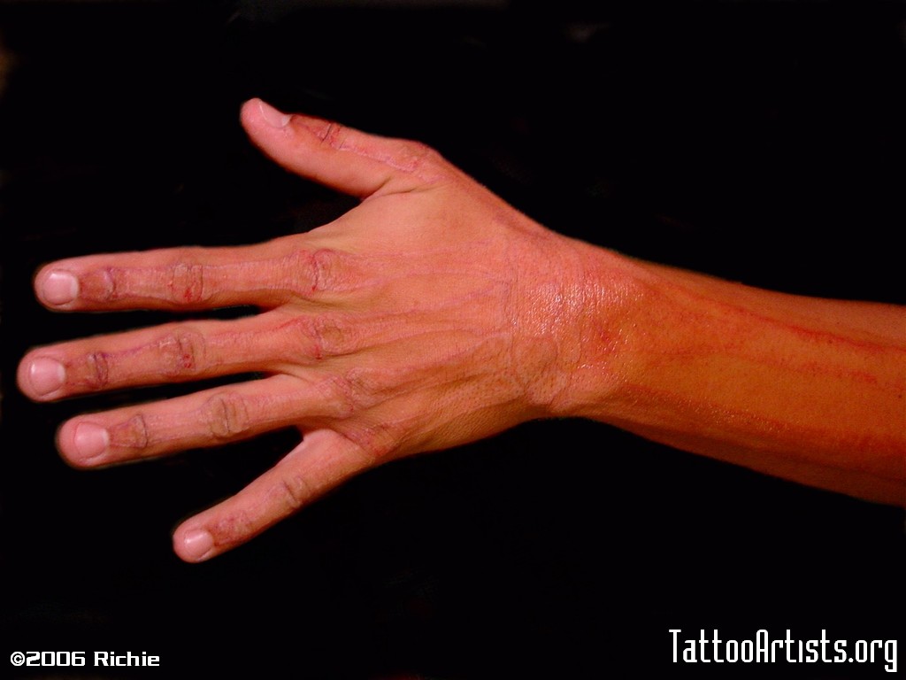 UV Hand Skeleton In Normal Light Tattoo