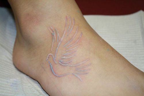White Bird Scarification Tattoo On Foot