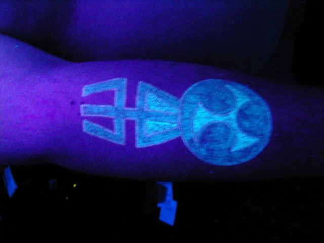 White Ink Uv Alien Tattoo On Arm