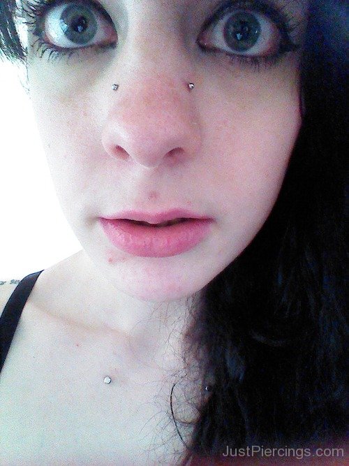 Woman With Big Eyes Have High Nostril Piercing