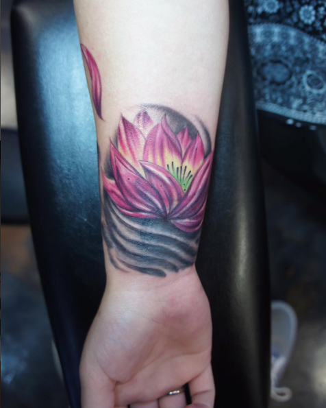 Amazing Lotus Tattoo On Wrist by Artistic Element