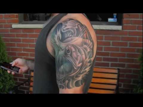 Angler Fish Colored Tattoo On Left Half Sleeve For Men