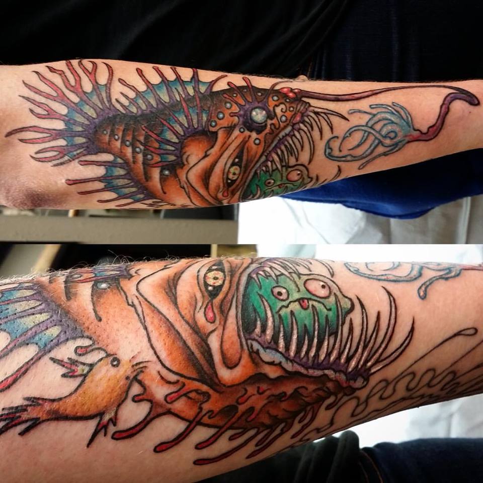 Angler Fish Eating Tattoo On Arm By Nick Hetzel