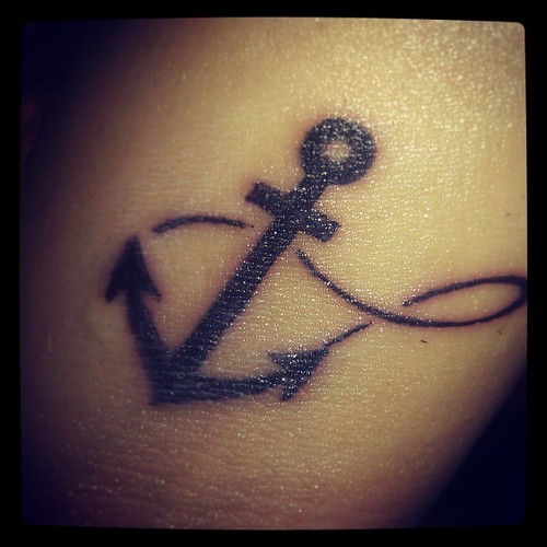 Attractive Black Anchor And Infinity Symbol Tattoo.