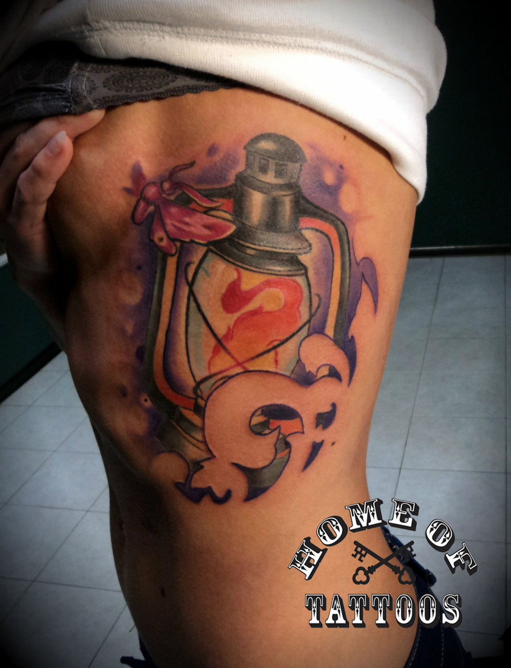 Attractive Lantern With Moth Tattoo On Side Rib For Girls