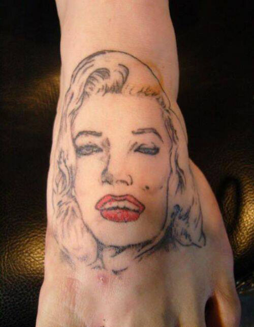 Awful Marilyn Monroe Face Tattoo On Foot