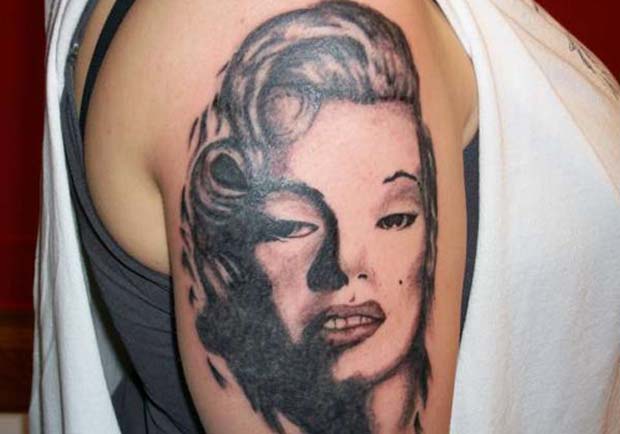 Awful Marilyn Monroe Face Tattoo On Right Shoulder