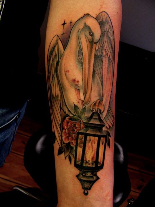 Bird With Lantern And Traditional Flower Tattoo On Forearm