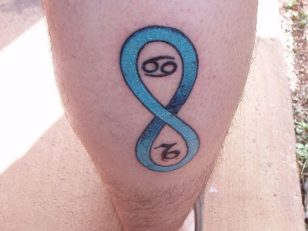 Blue Infinity Symbol Tattoo On Back Leg