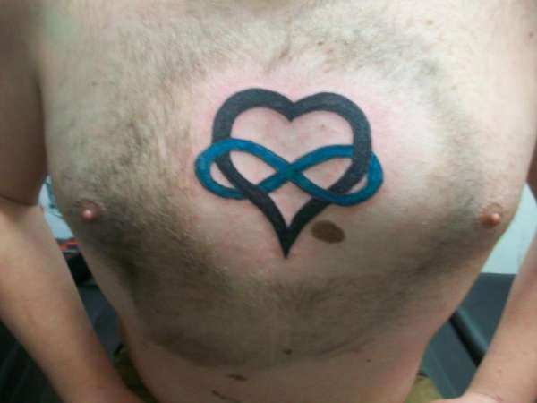 Blue Infinity With Black Heart Tattoo On Chest