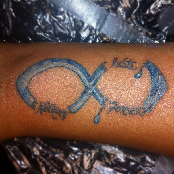 Broken Infinity Symbol Tattoo On Arm