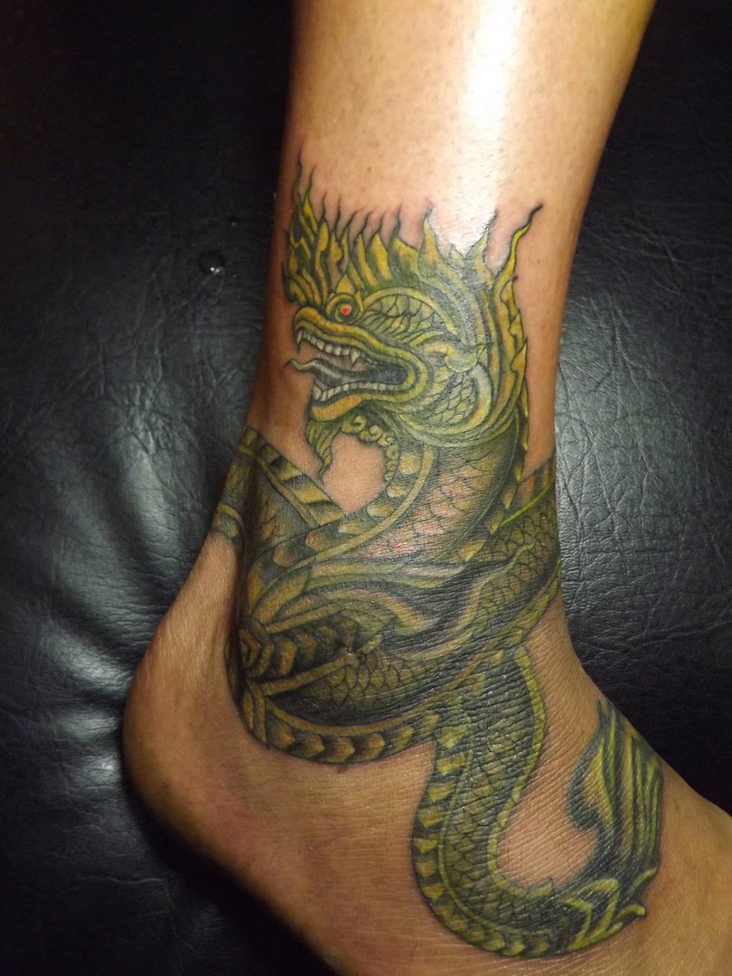 Colored Thai Dragon Tattoo On Ankle