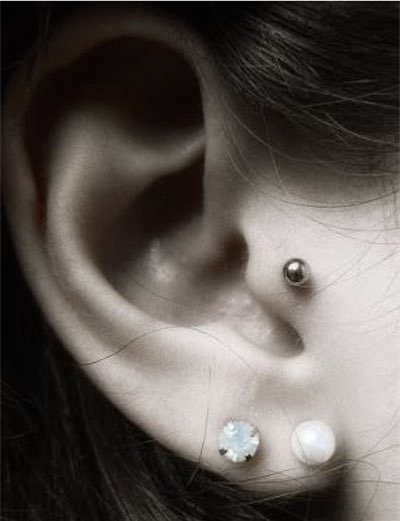 Dual Lobe And Tragus Piercing With Silver Stud