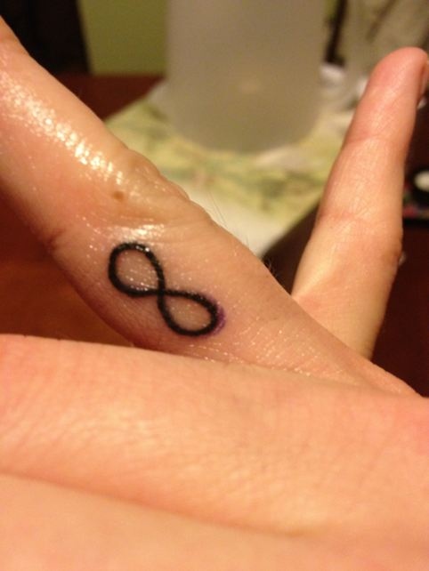 Fresh Small Black Infinity Tattoo On Finger