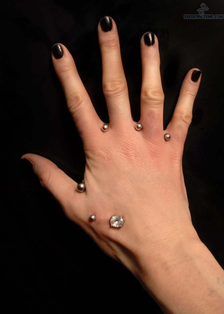 Girl With Hand Web Piercings With Silver Studs