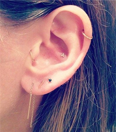 Girl With Left Ear Lobe And Tragus Piercing