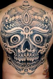 Happy Tibetan Skull Tattoo On Back