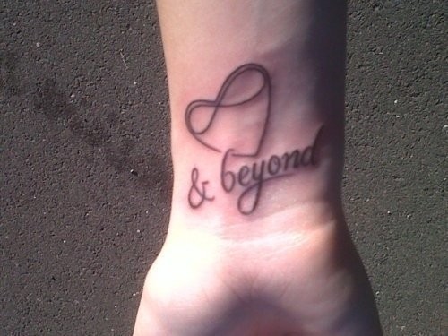 Heart Shaped Infinity Symbol With Lettering Tattoo On Wrist