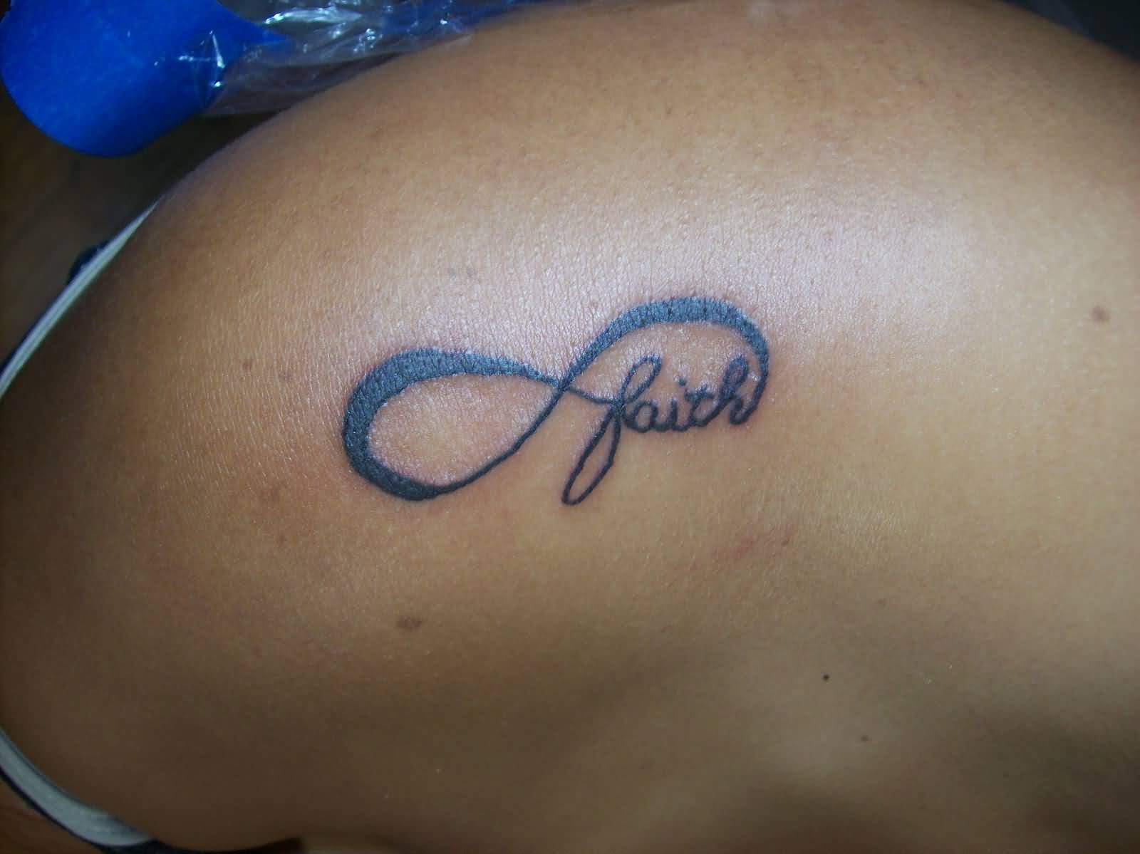 Impressive Faith Infinity Symbol Tattoo On Upper Shoulder