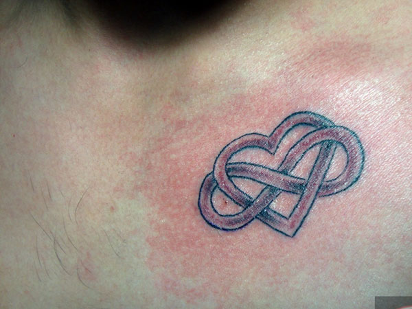 Interlocked Infinity Heart Tattoo On Chest