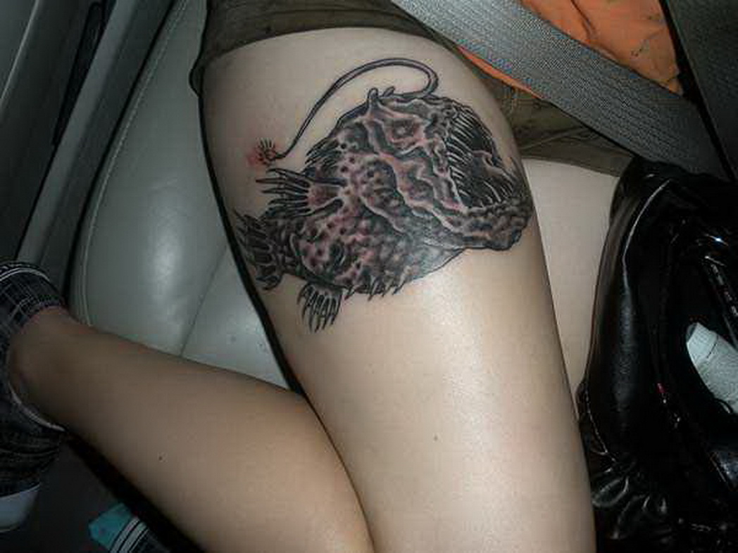 Killer Angler Fish Tattoo On Right Thigh For Girls