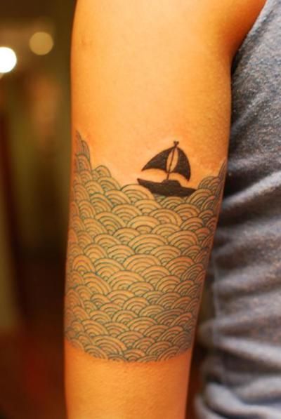 Knitted Sea And Ship Tattoo On Arm