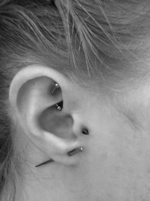 Lobe And Tragus Piercing With Black Spike Stud